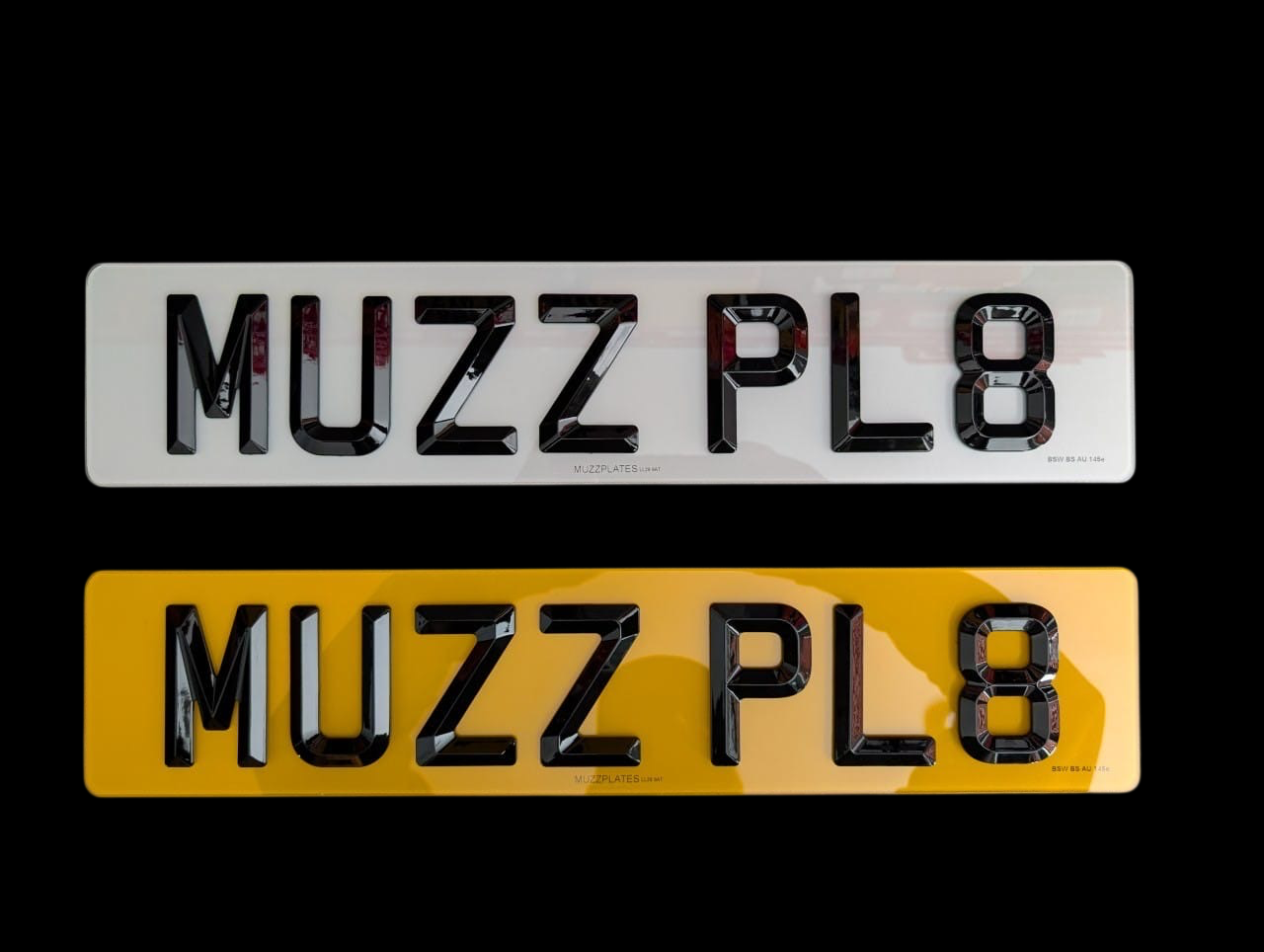 Two bevelled edge number plates with 'MUZZPLATES' branding on a black background